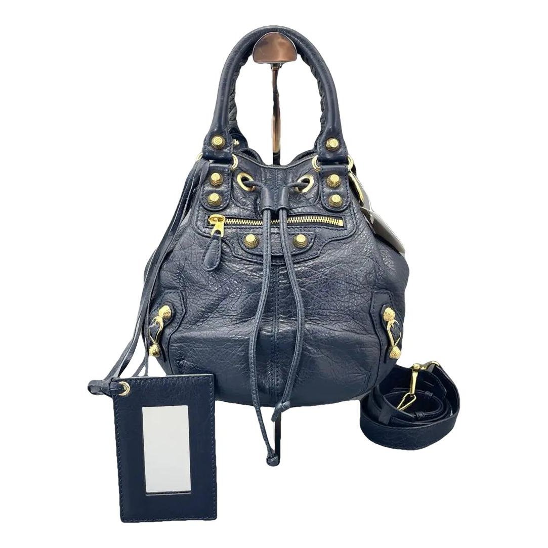 Pompon leather crossbody bag