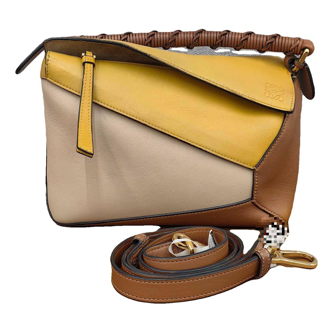 Puzzle leather handbag