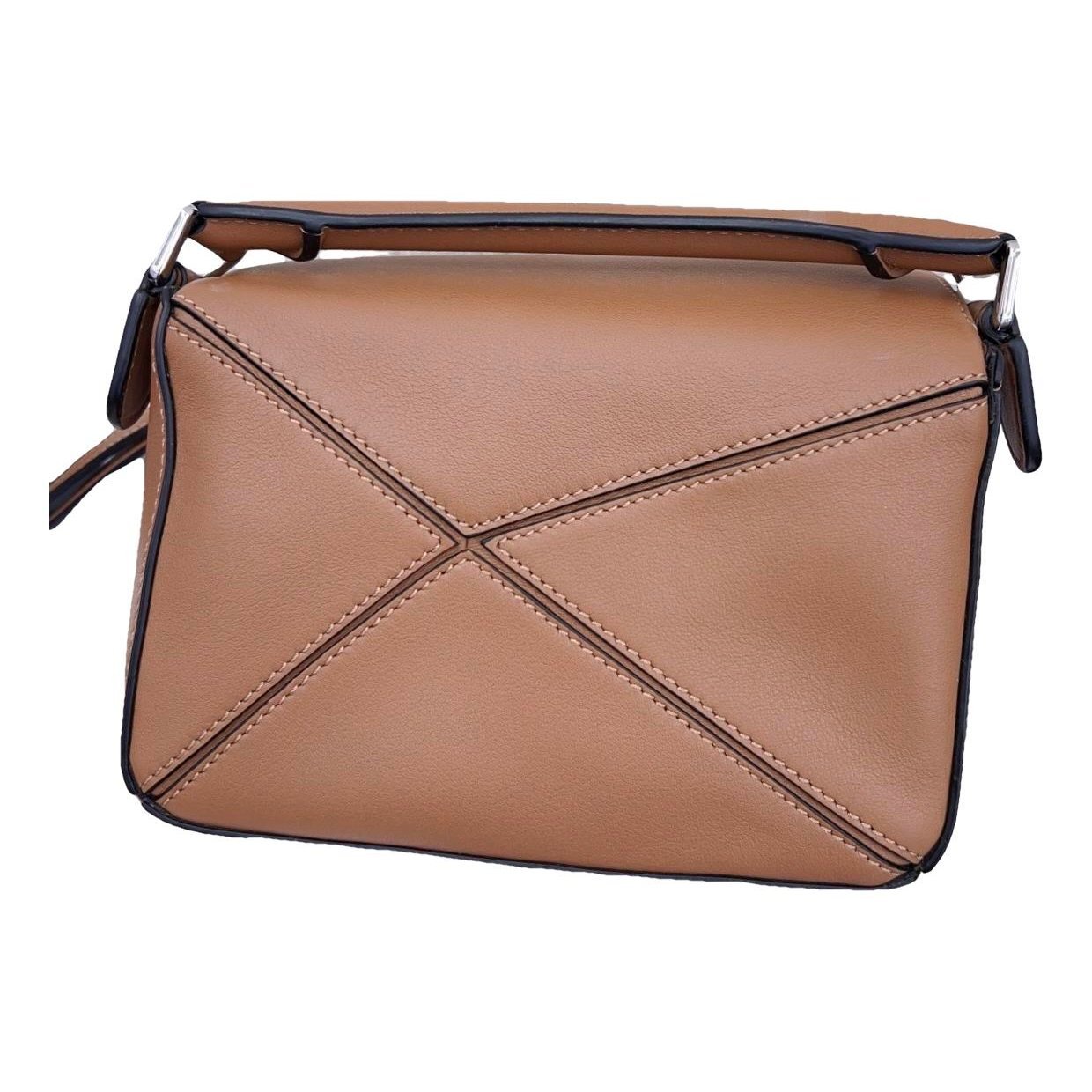 Puzzle leather handbag