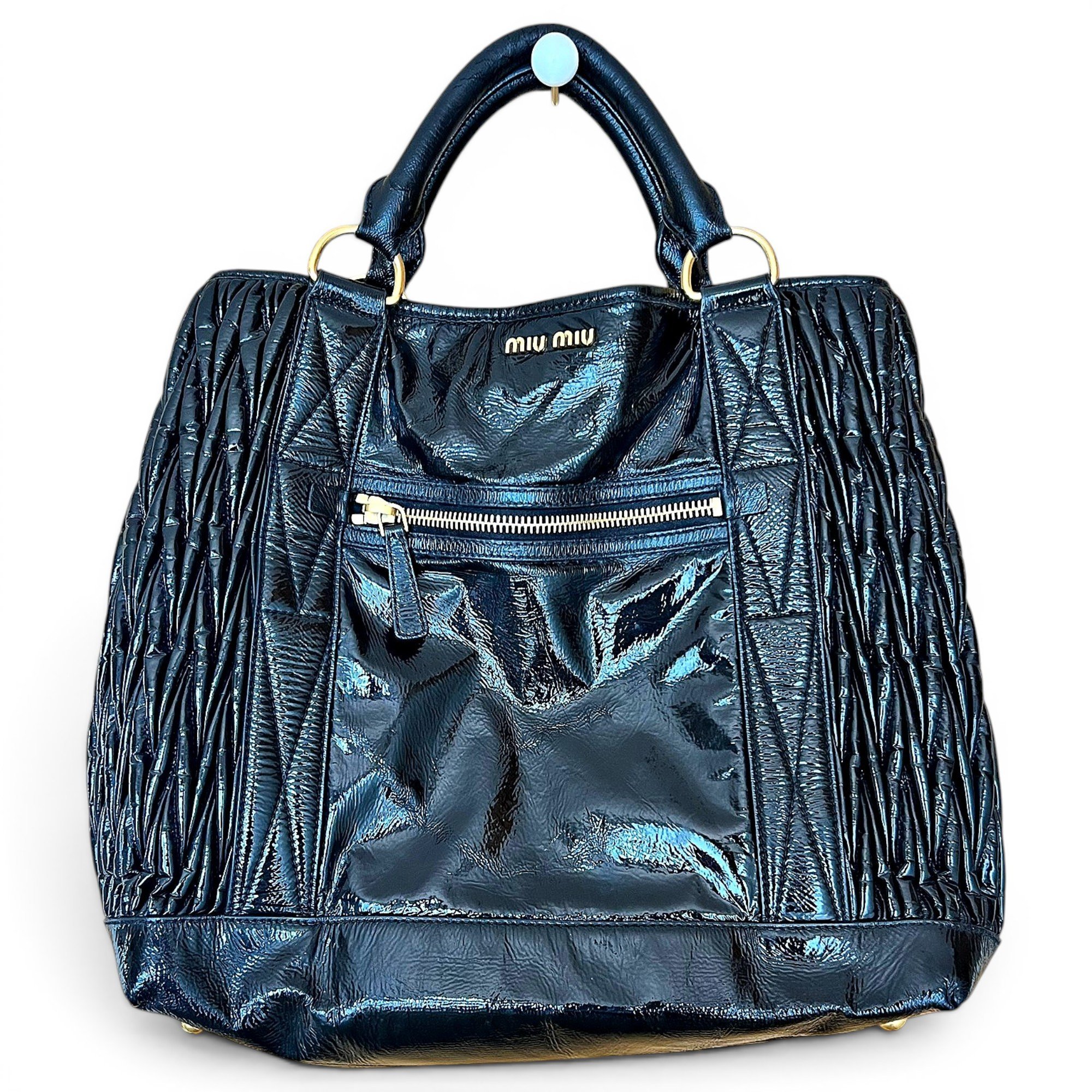 Matelassé patent leather handbag