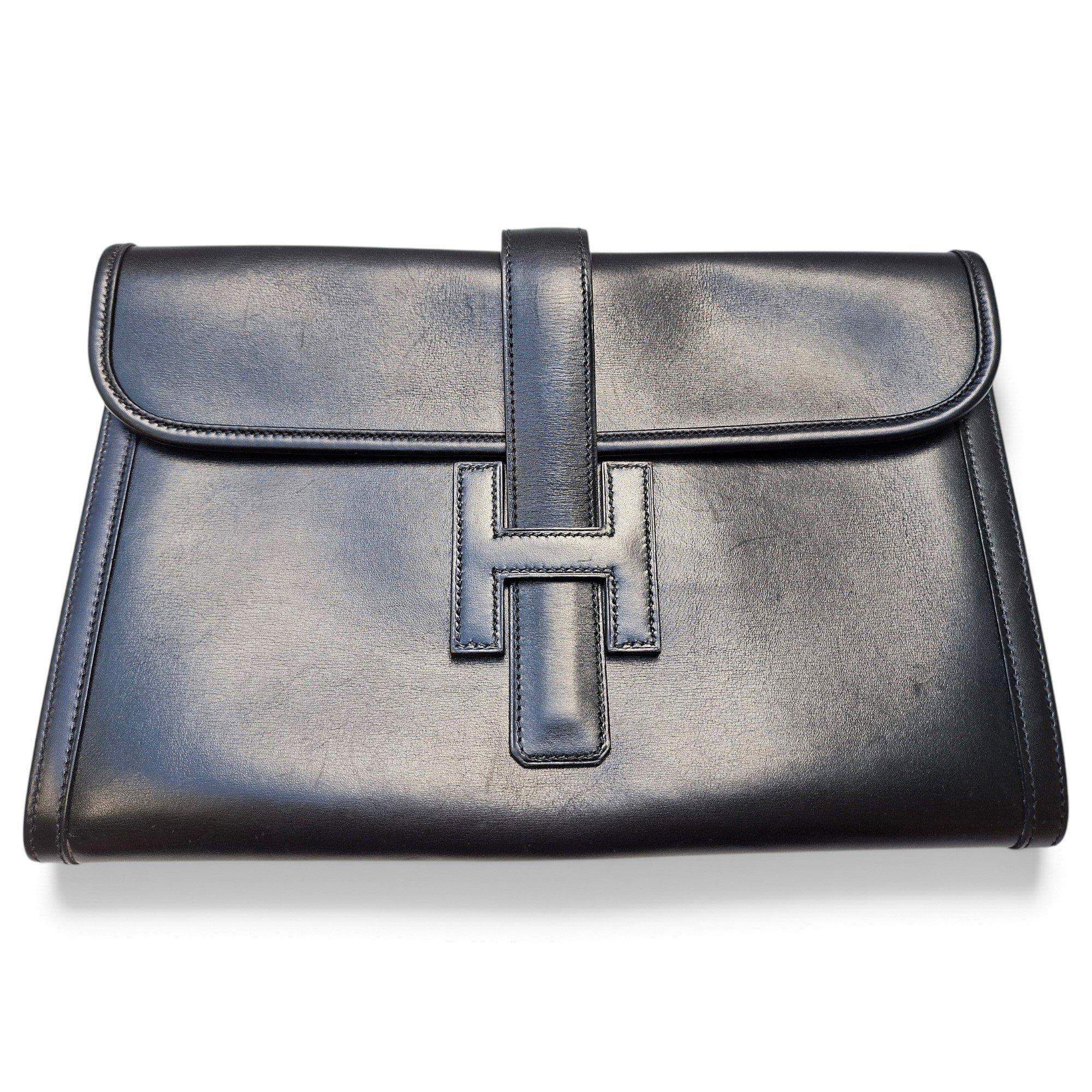 Jige leather clutch bag