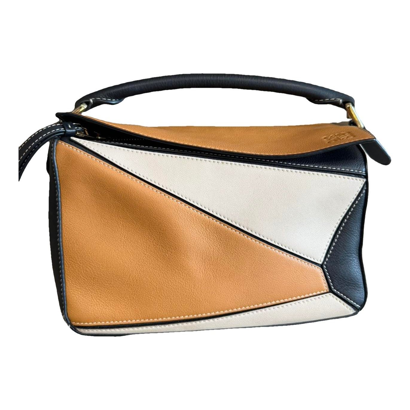 Puzzle leather handbag