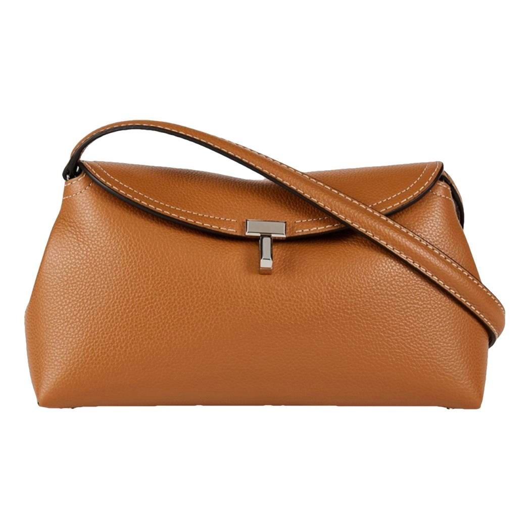 Toteme T-Lock leather clutch bag