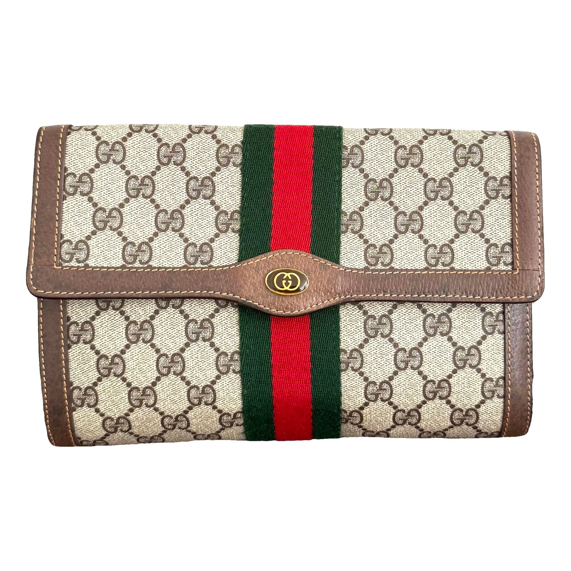 Ophidia patent leather clutch bag