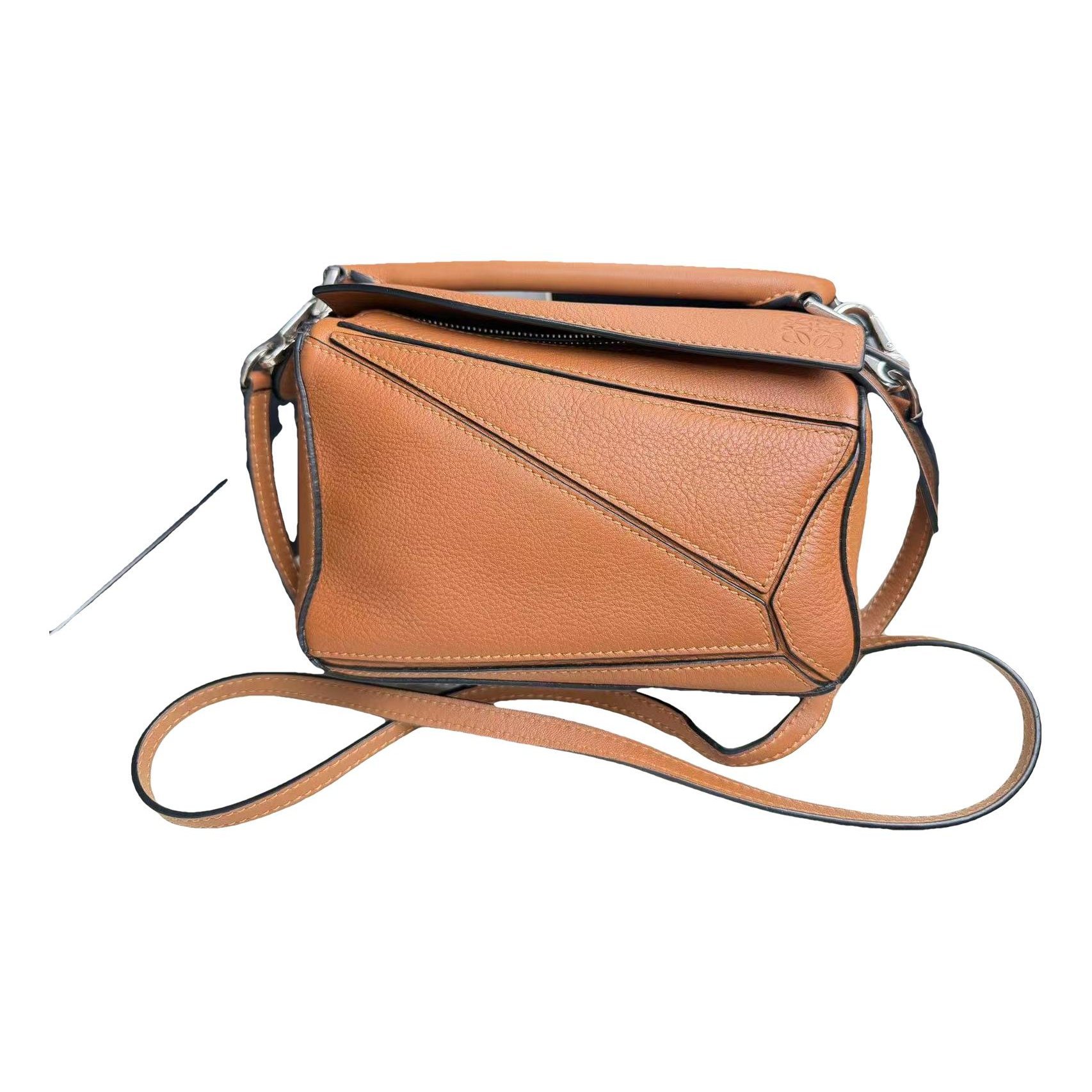 Puzzle leather handbag