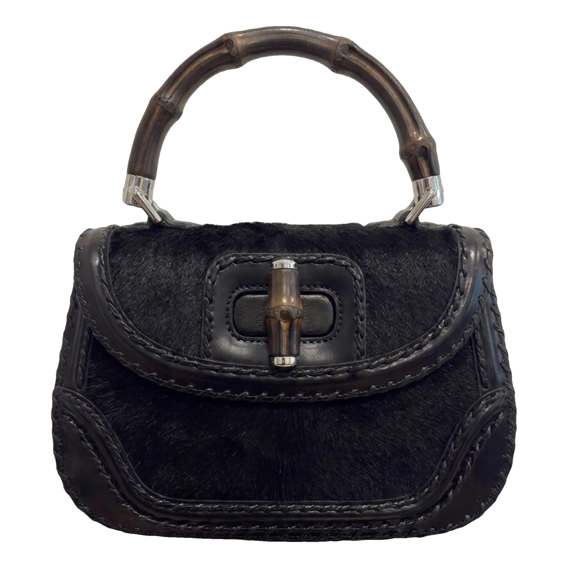 Convertible Pompon Bamboo Top Handle leather handbag