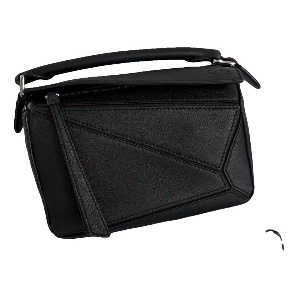 Puzzle leather handbag