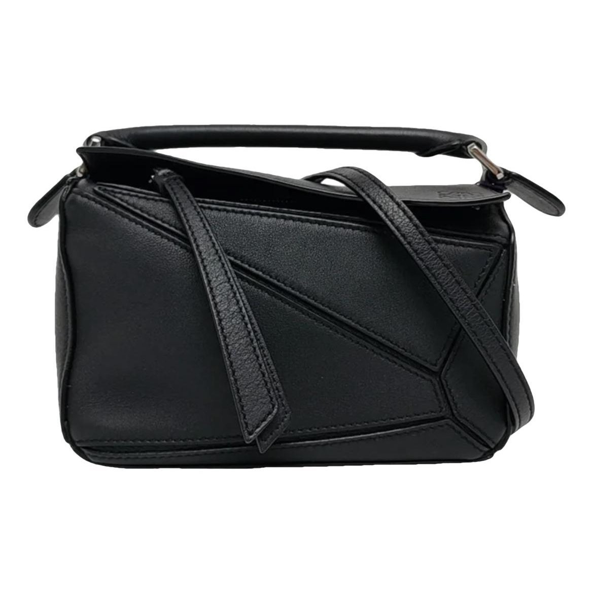 Puzzle leather handbag