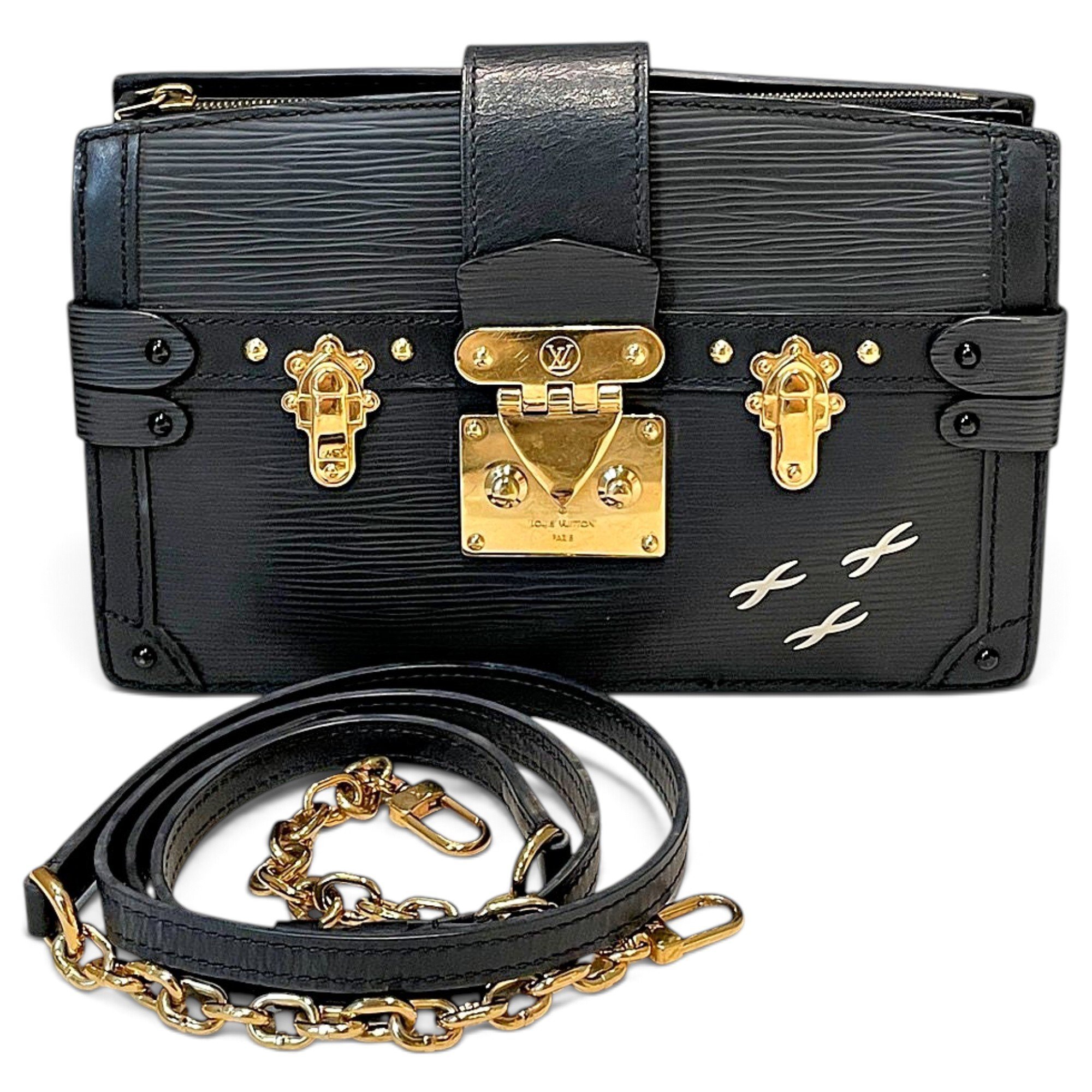 Pochette Trunk leather handbag