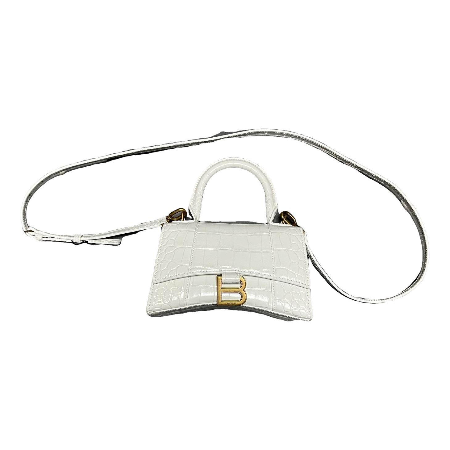 Hourglass patent leather handbag