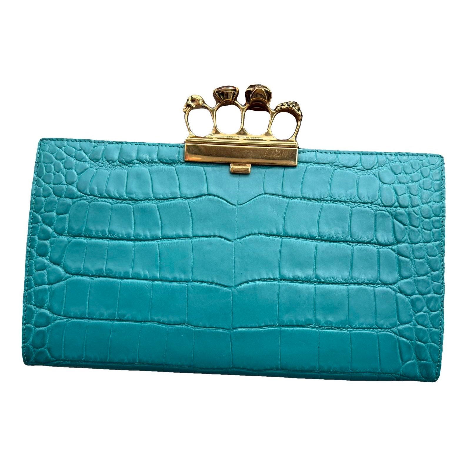 Knuckle leather clutch bag