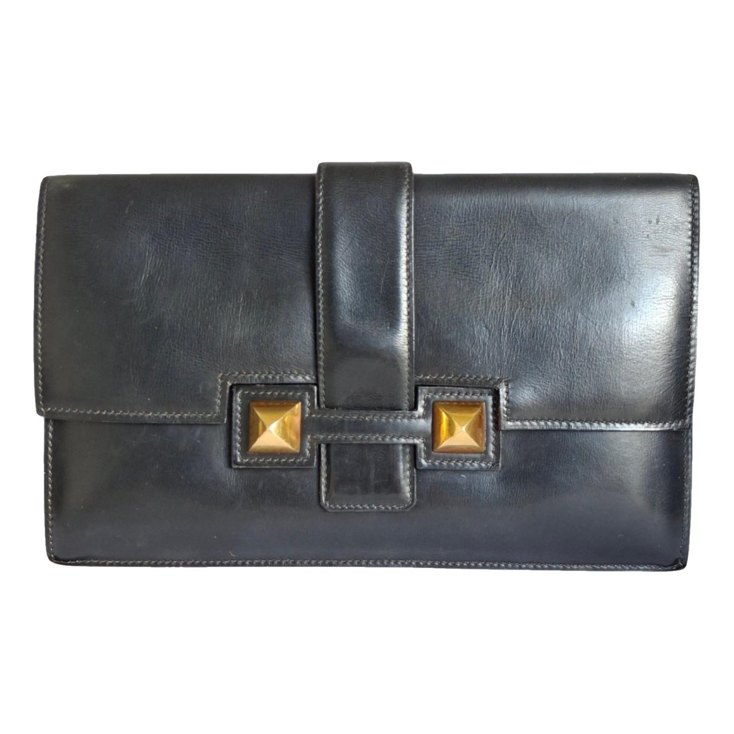 Médor leather clutch bag