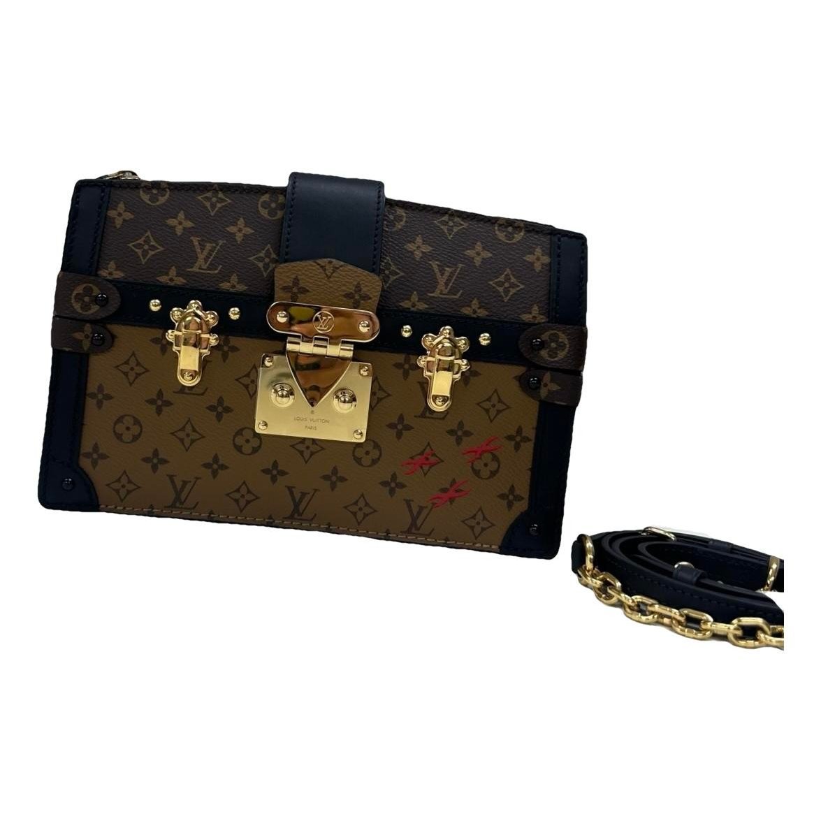 Pochette Trunk leather handbag