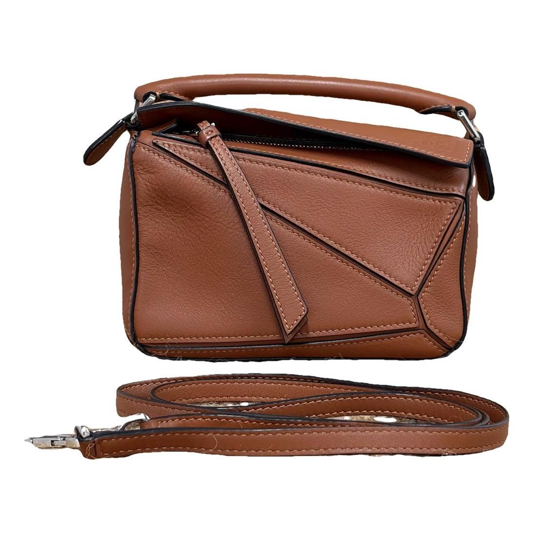 Puzzle leather handbag