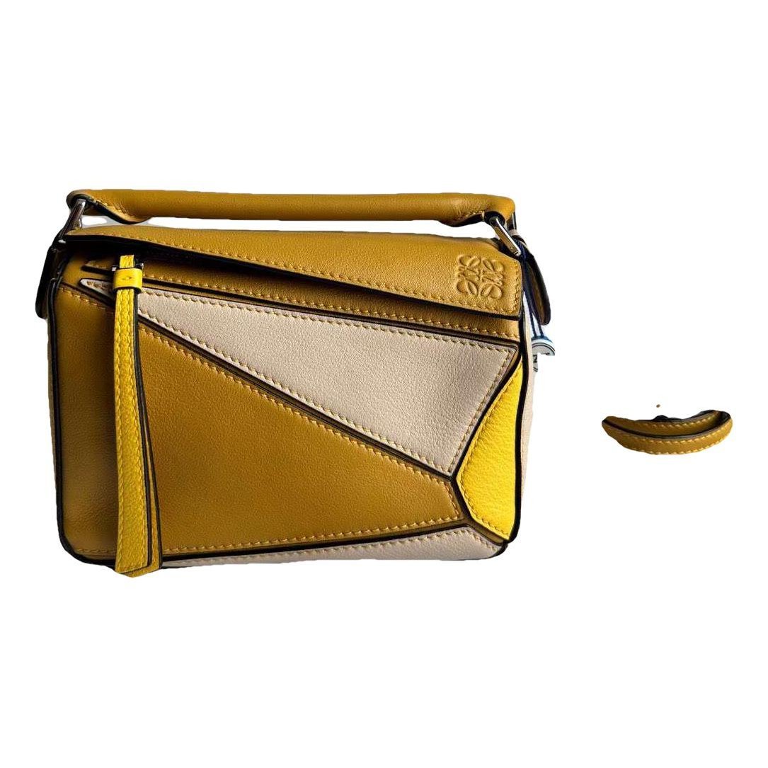 Puzzle leather handbag