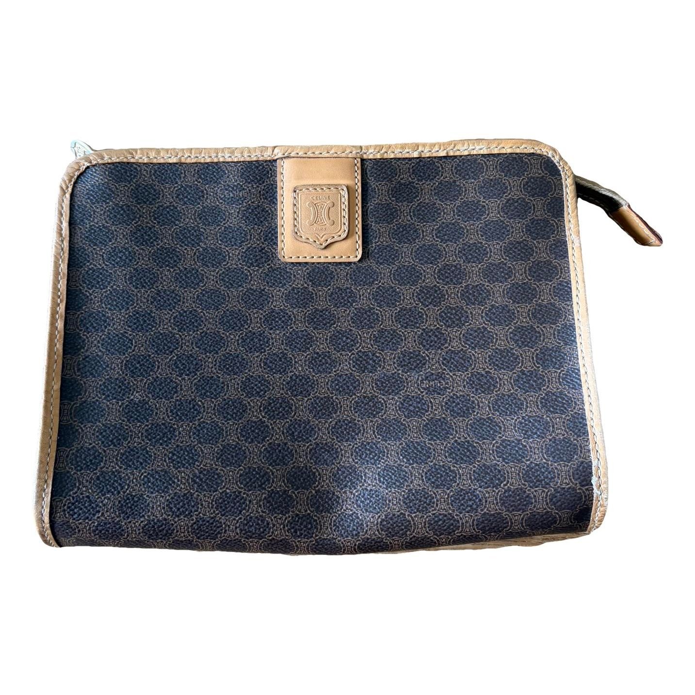 Triomphe Vintage leather clutch bag