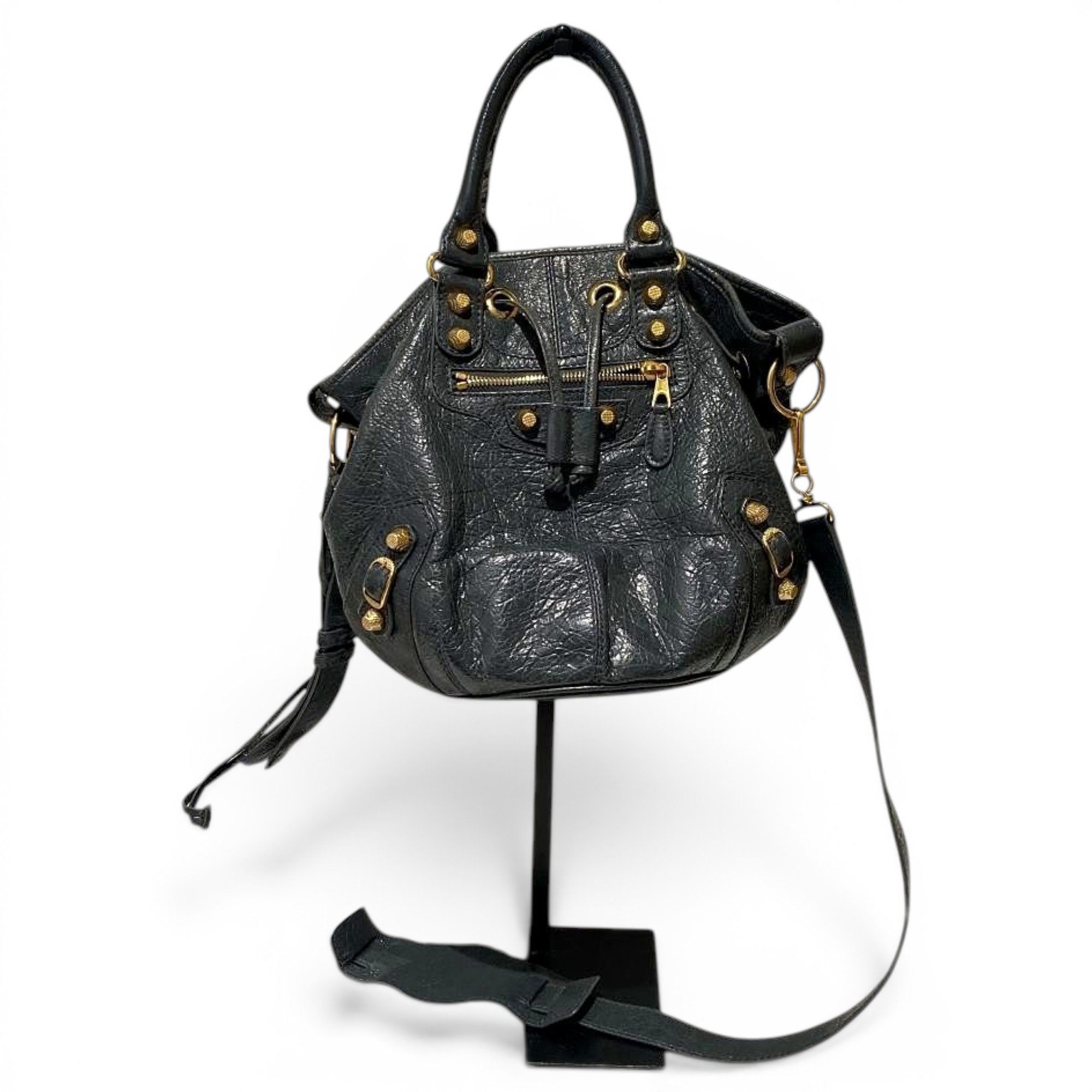 Pompon leather handbag