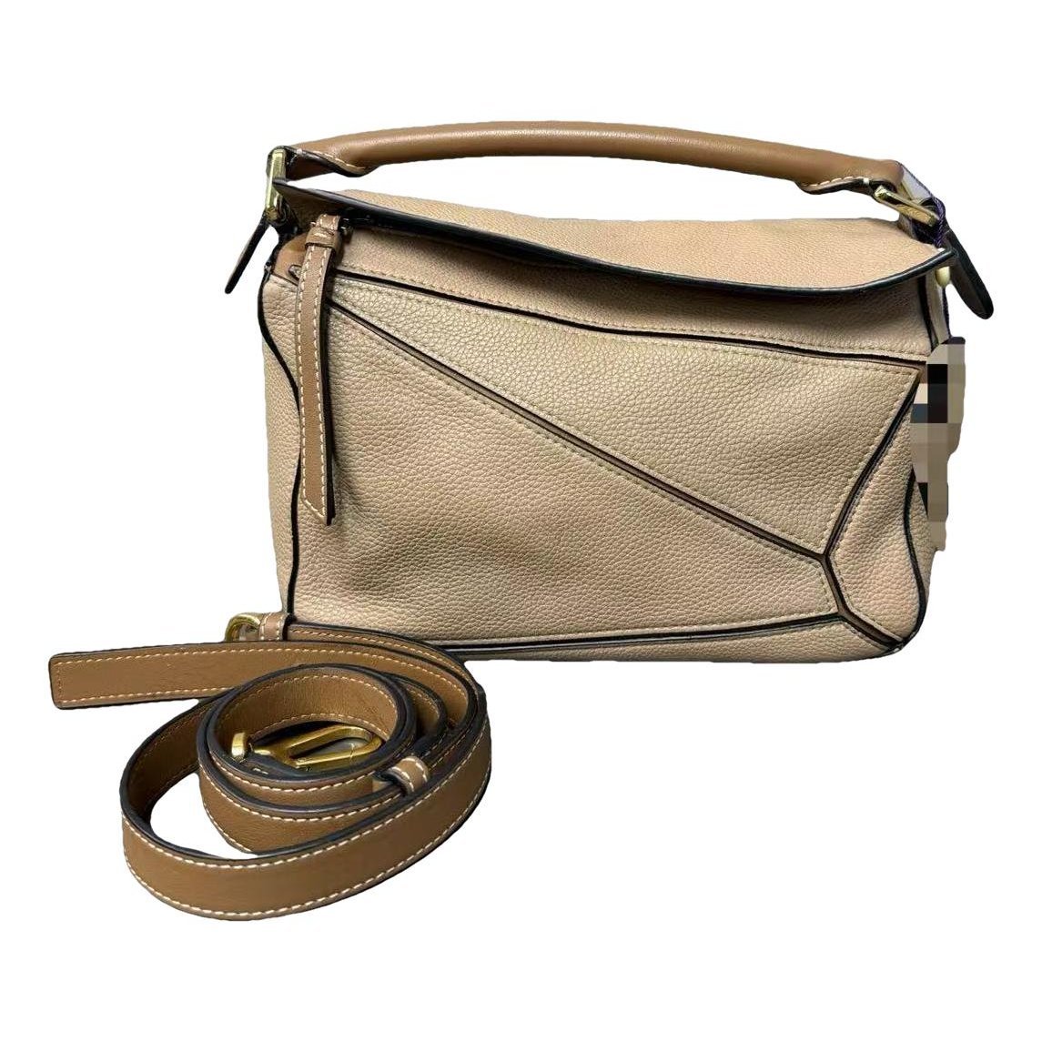 Puzzle leather handbag