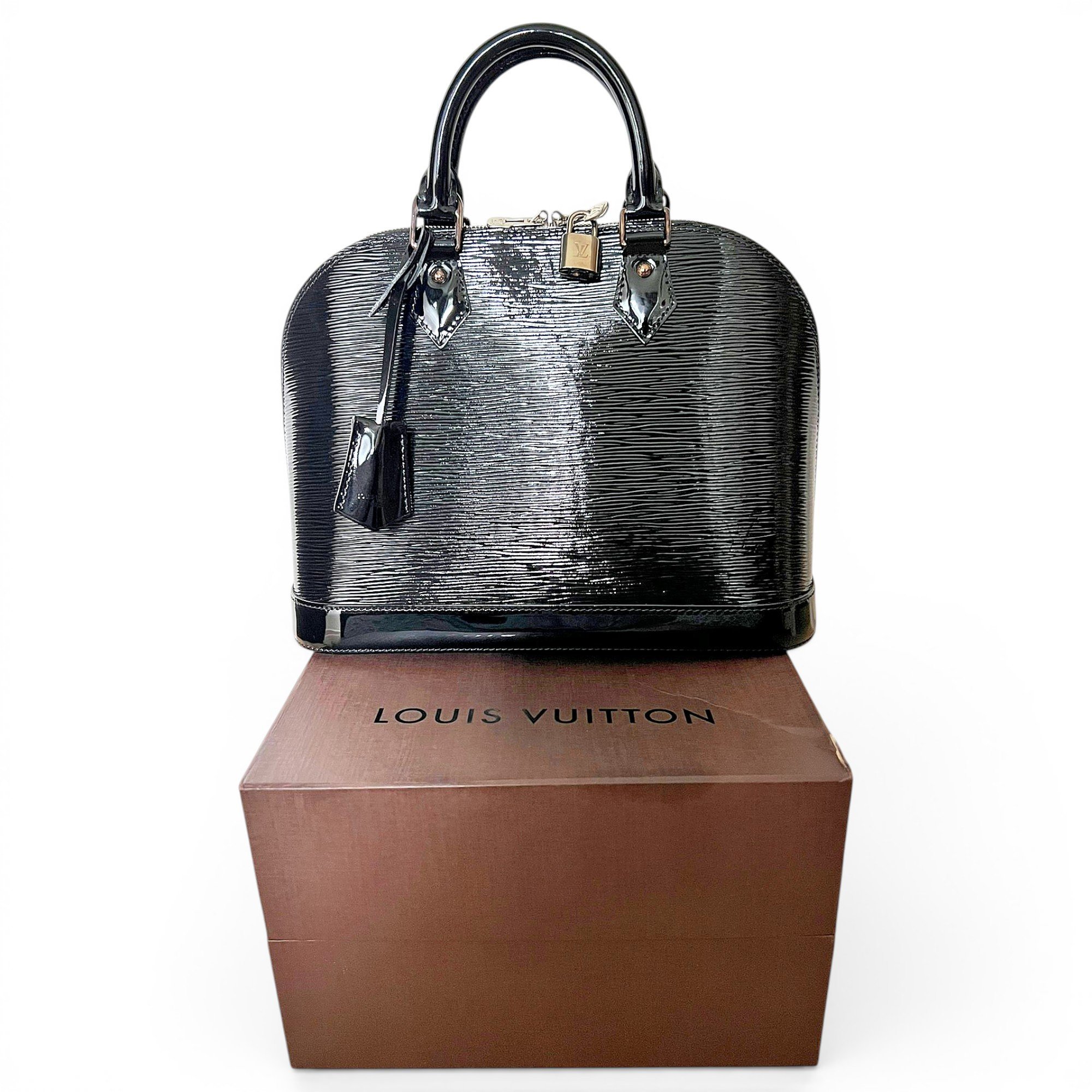 Louis Vuitton Alma patent leather handbag