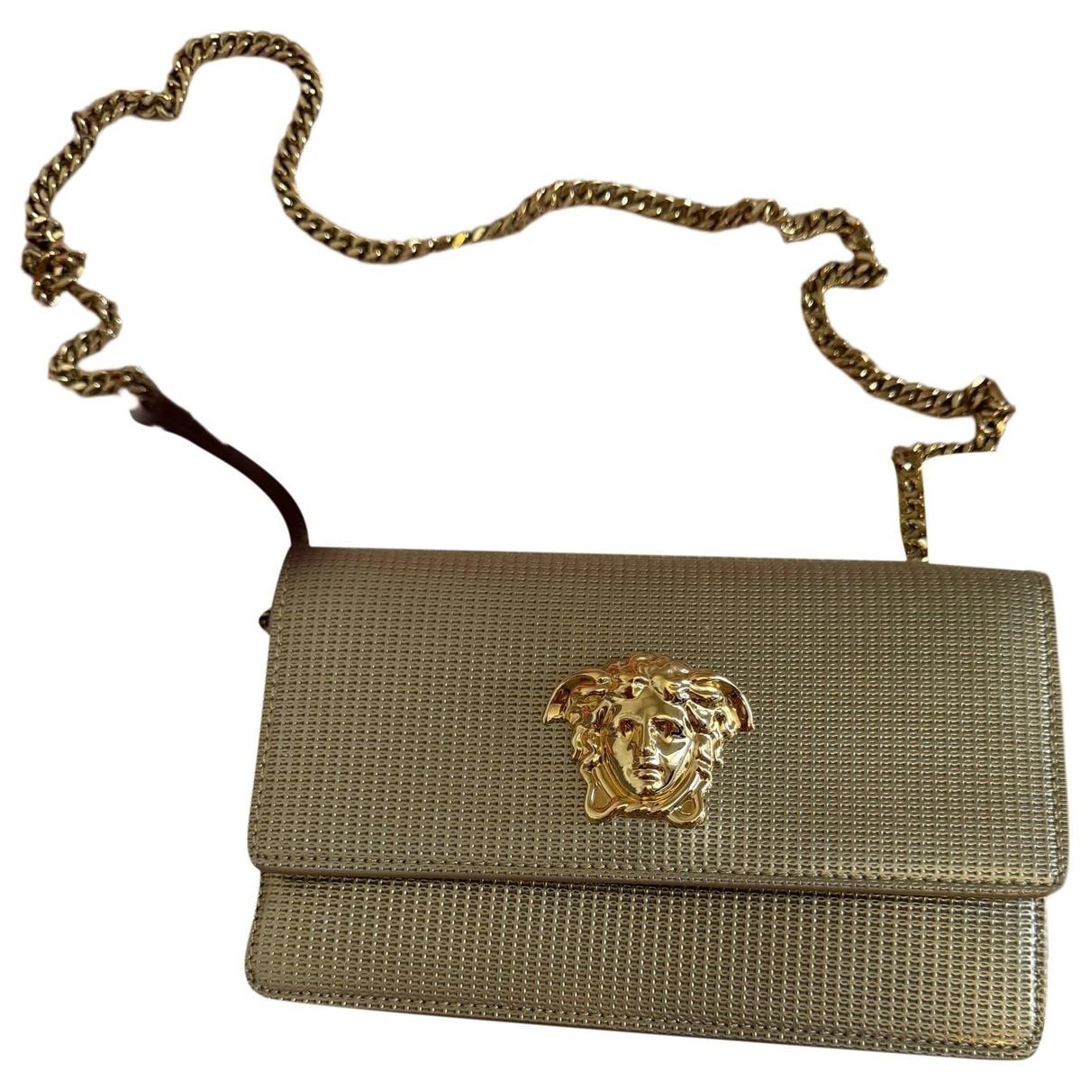 La Medusa leather clutch bag