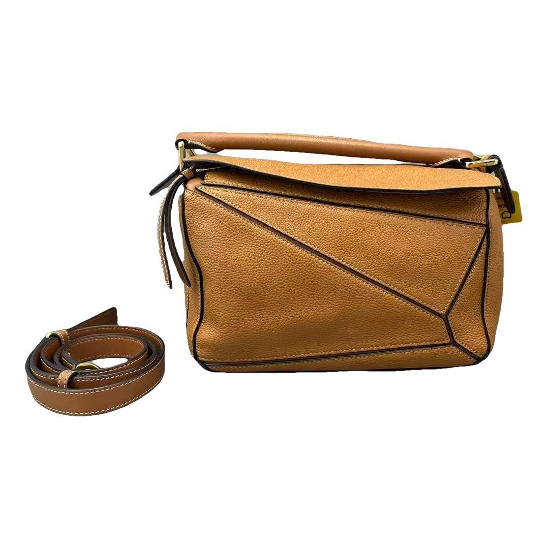 Puzzle leather handbag