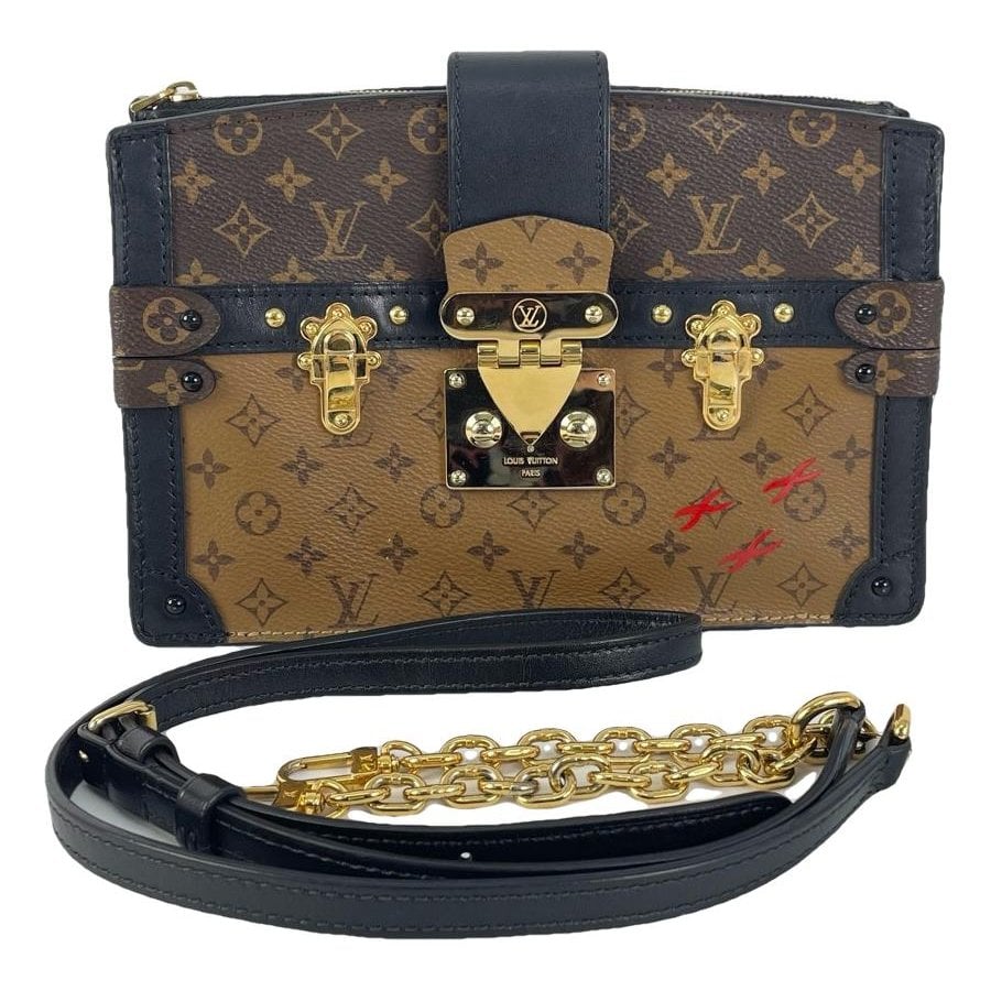 Pochette Trunk leather handbag