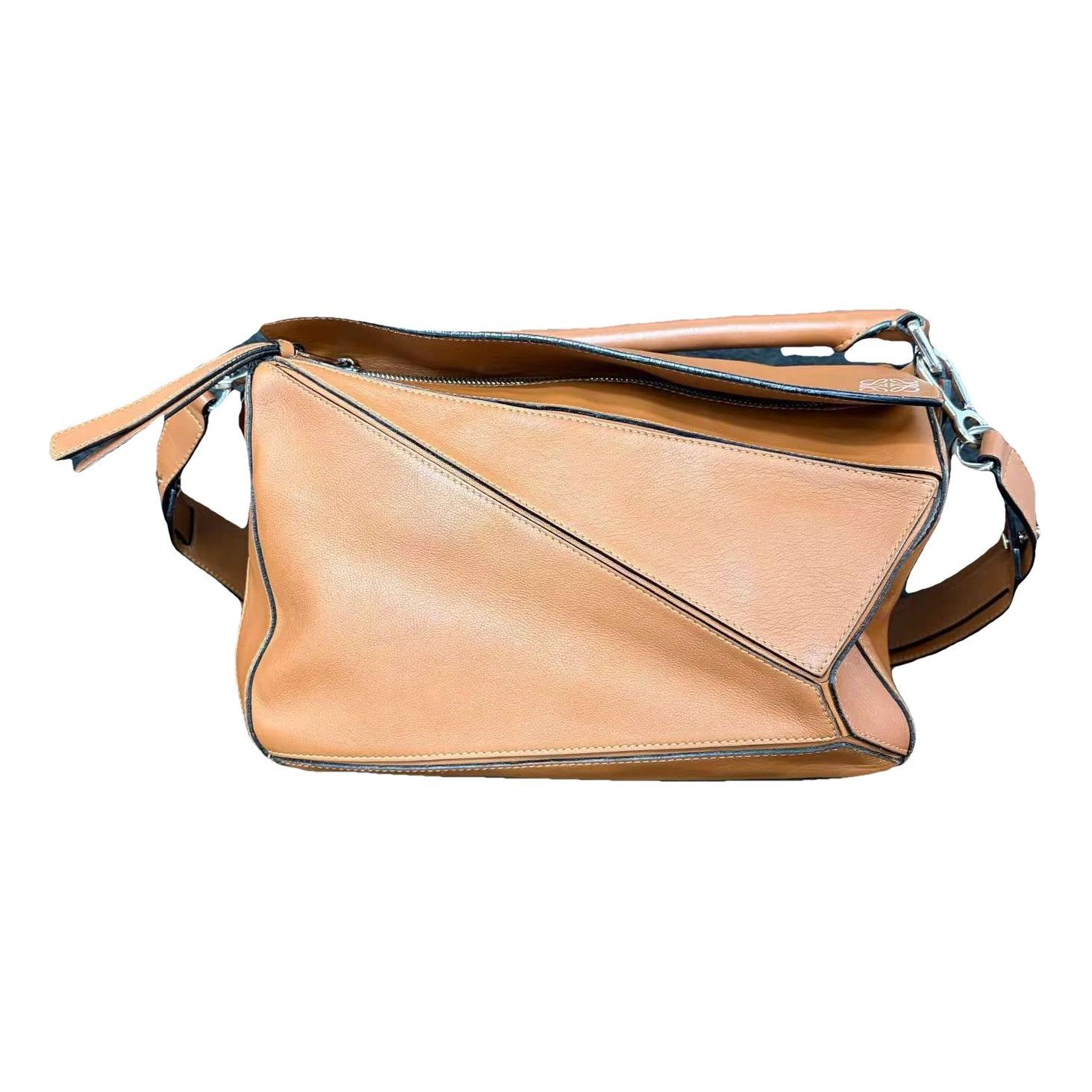 Puzzle leather handbag