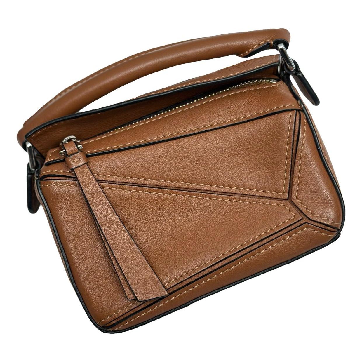 Puzzle leather handbag
