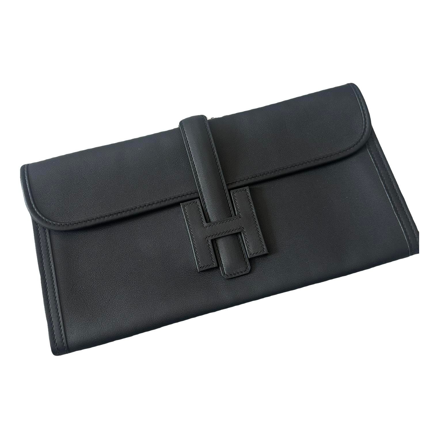 Jige leather clutch bag
