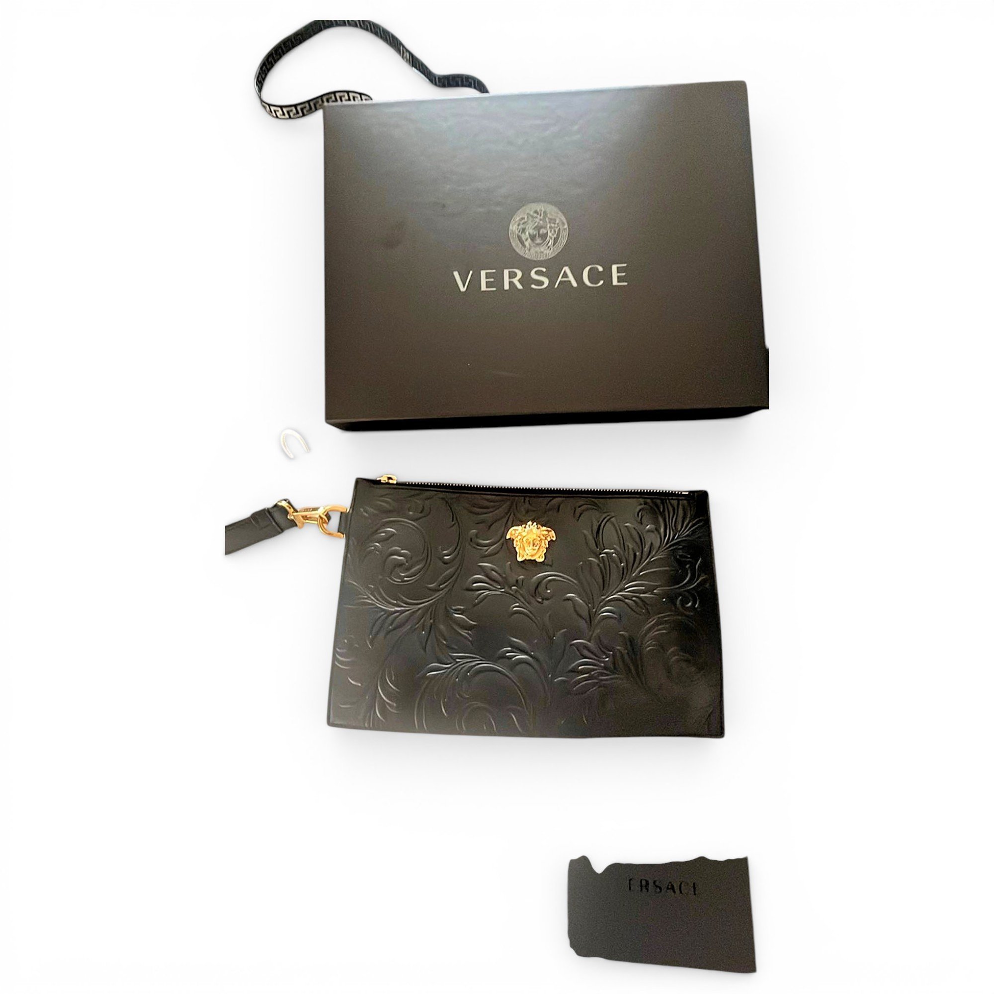 La Medusa leather clutch bag