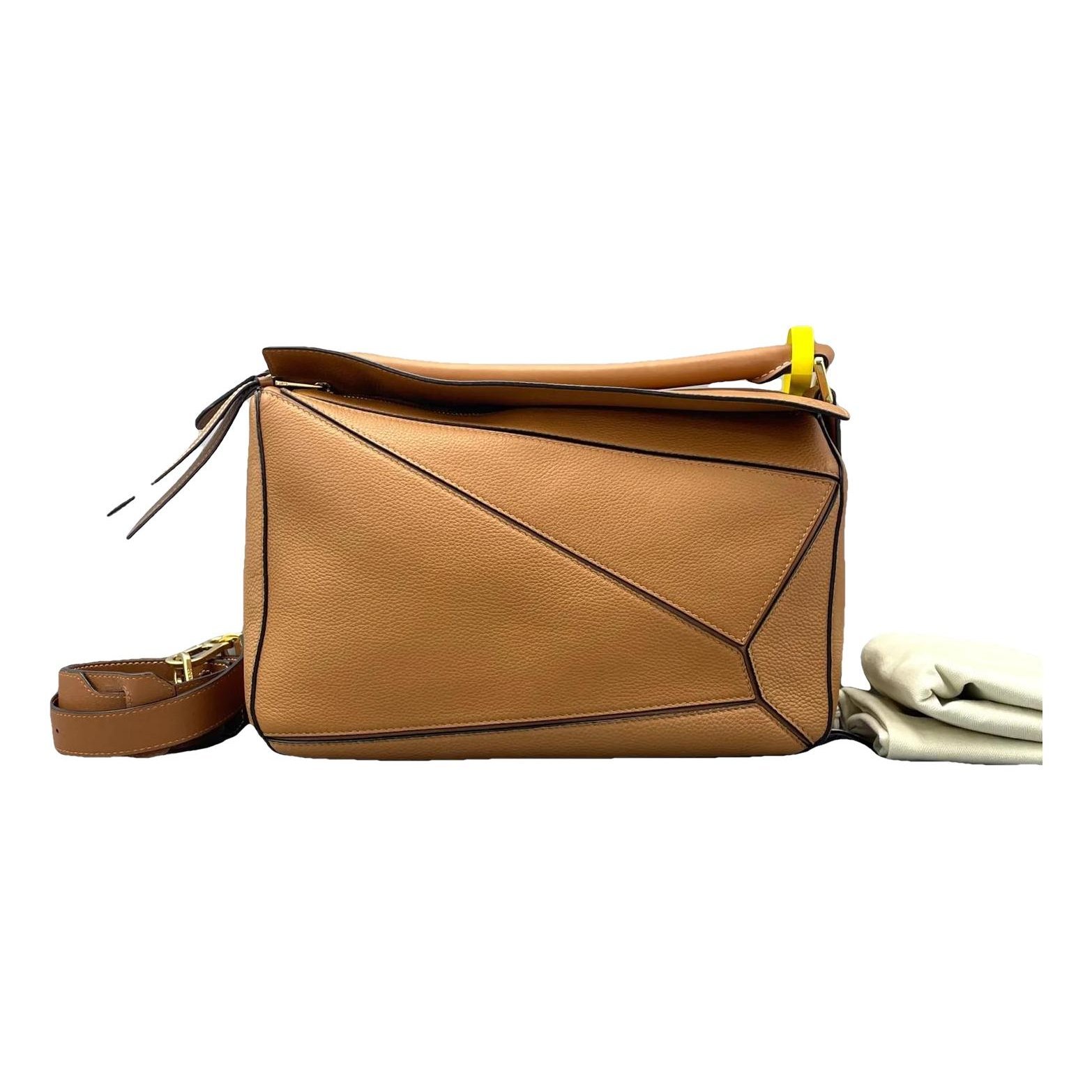 Puzzle leather crossbody bag