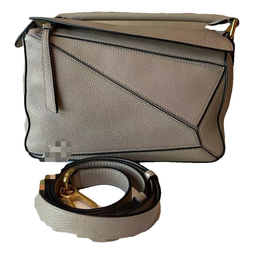Puzzle leather handbag