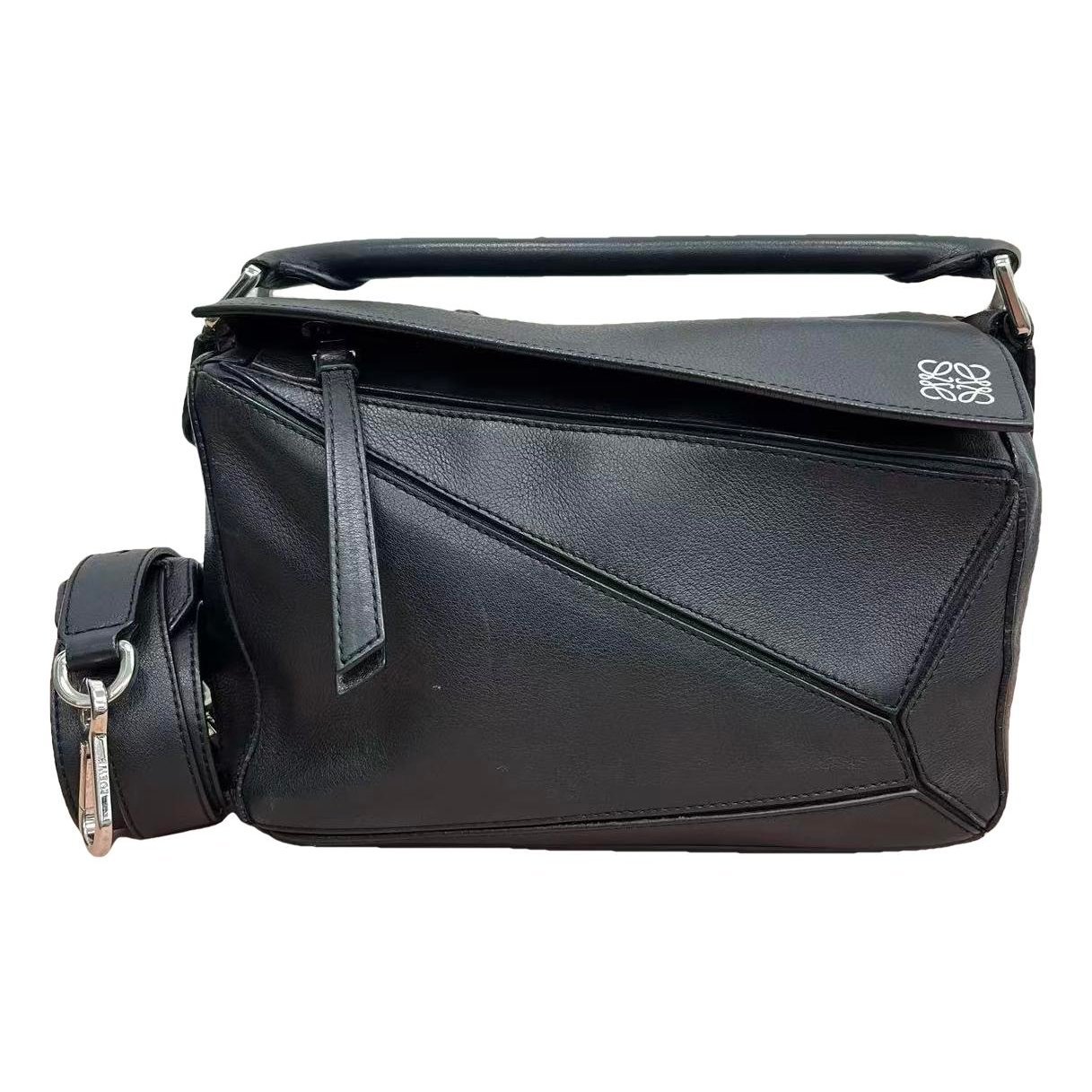 Puzzle leather handbag