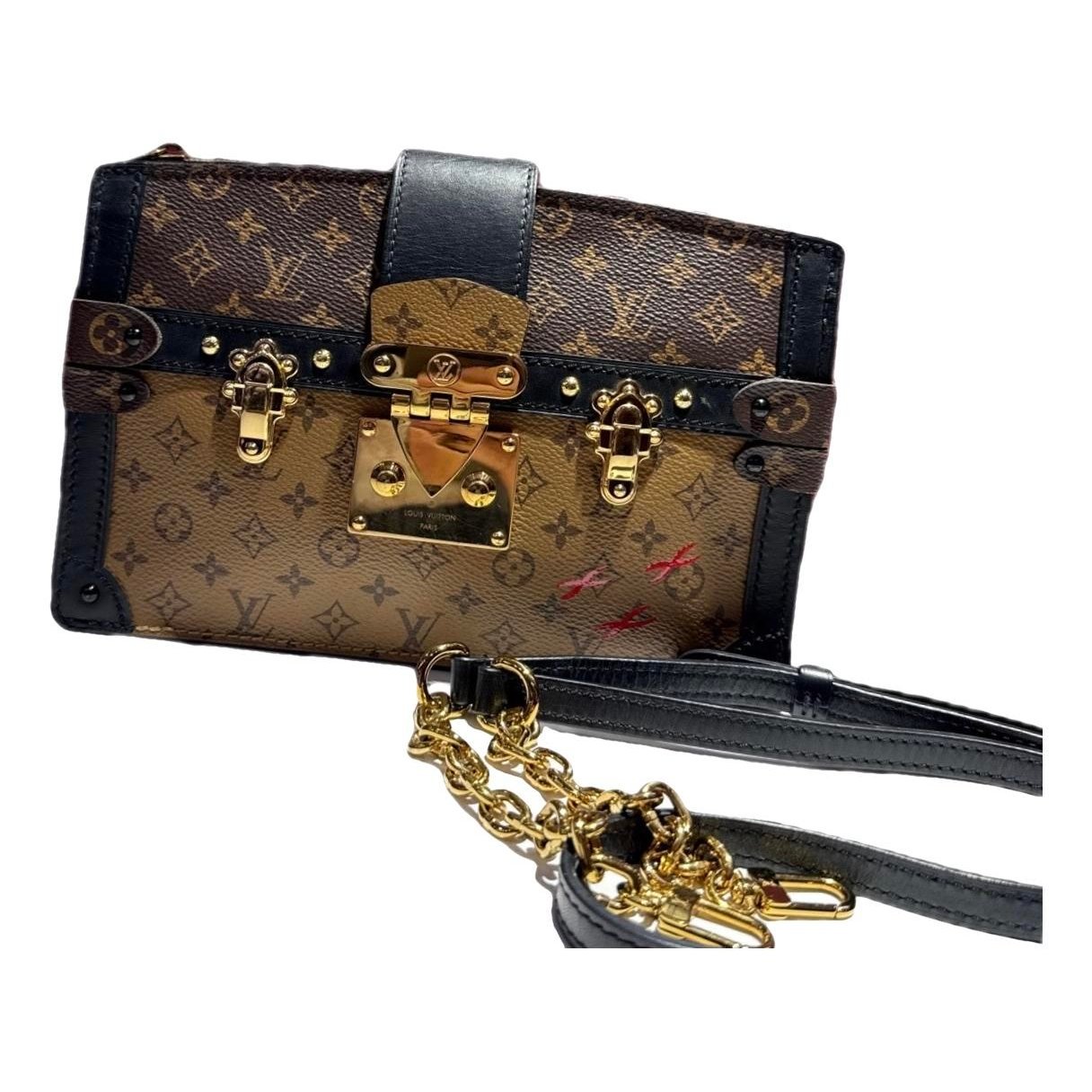 Pochette Trunk leather handbag