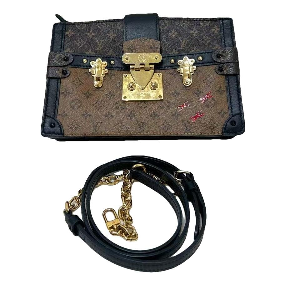 Pochette Trunk leather handbag