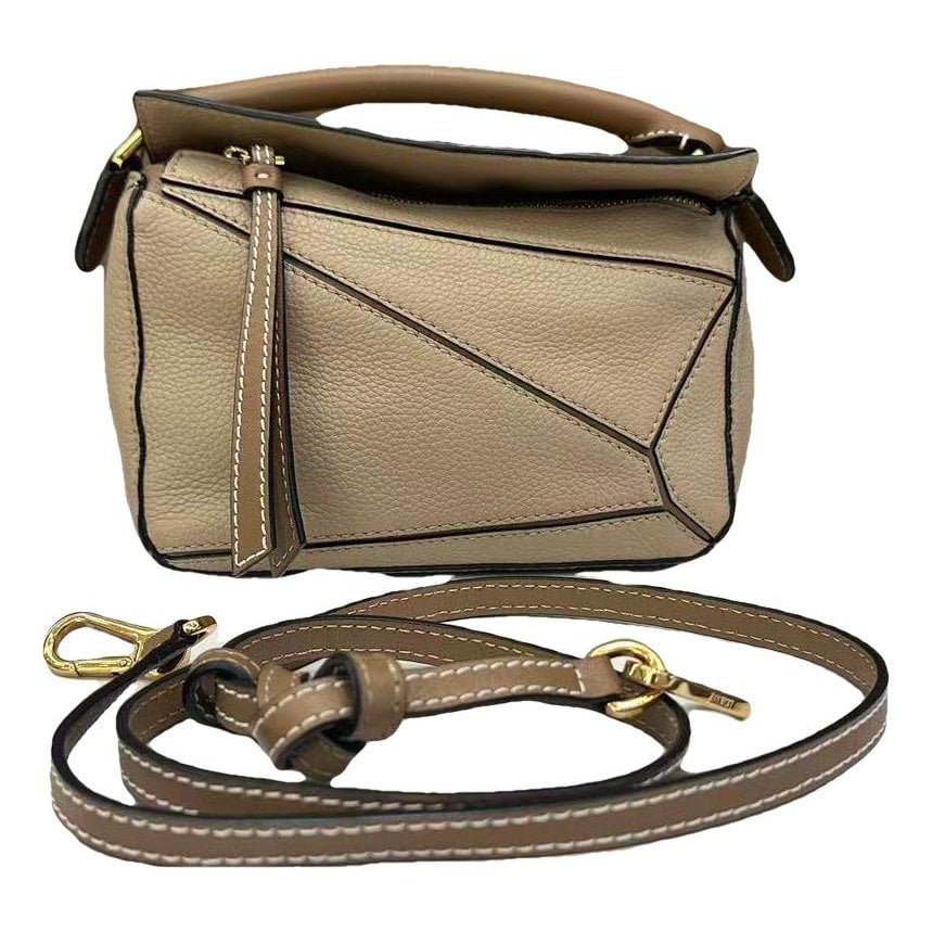 Puzzle leather handbag