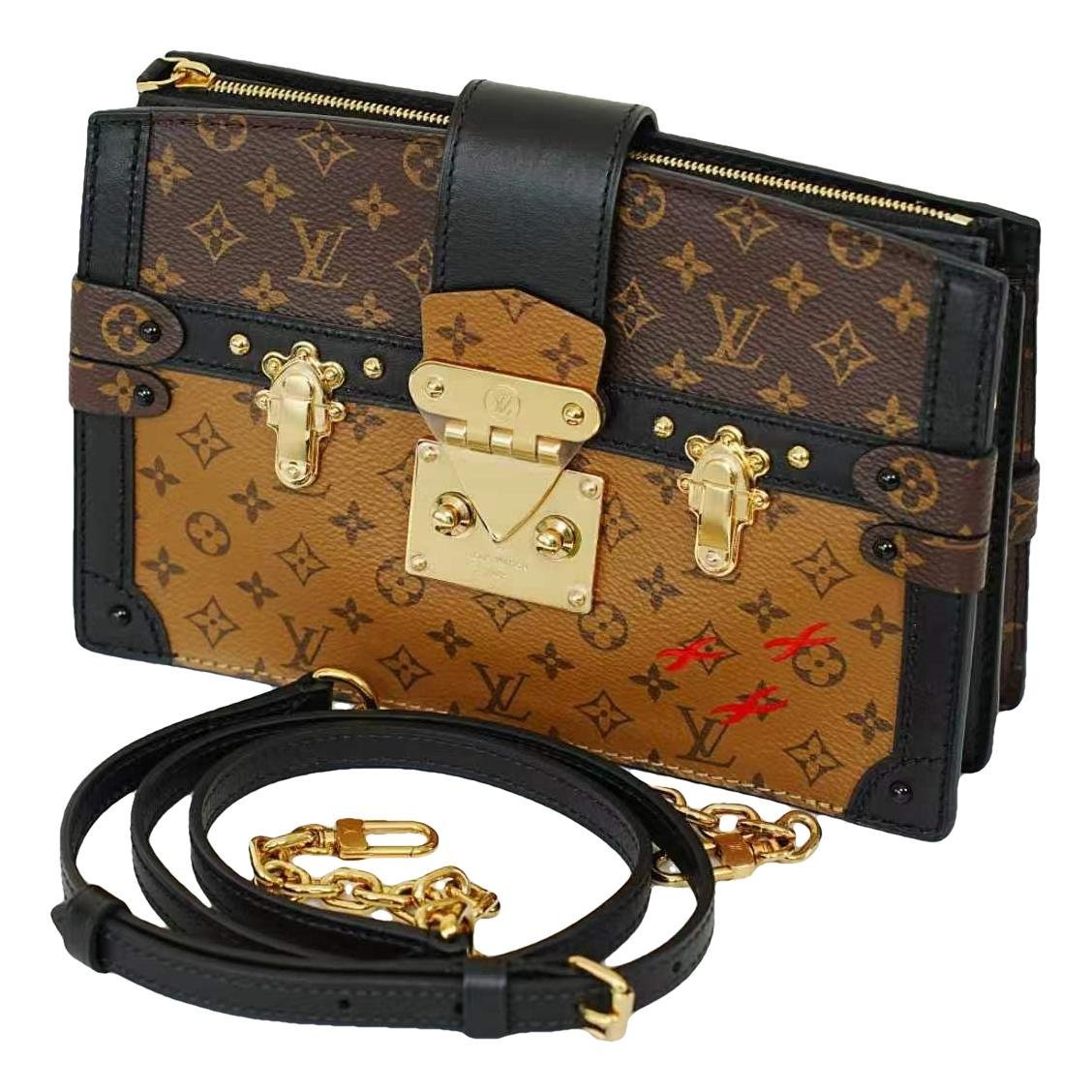Pochette Trunk leather handbag