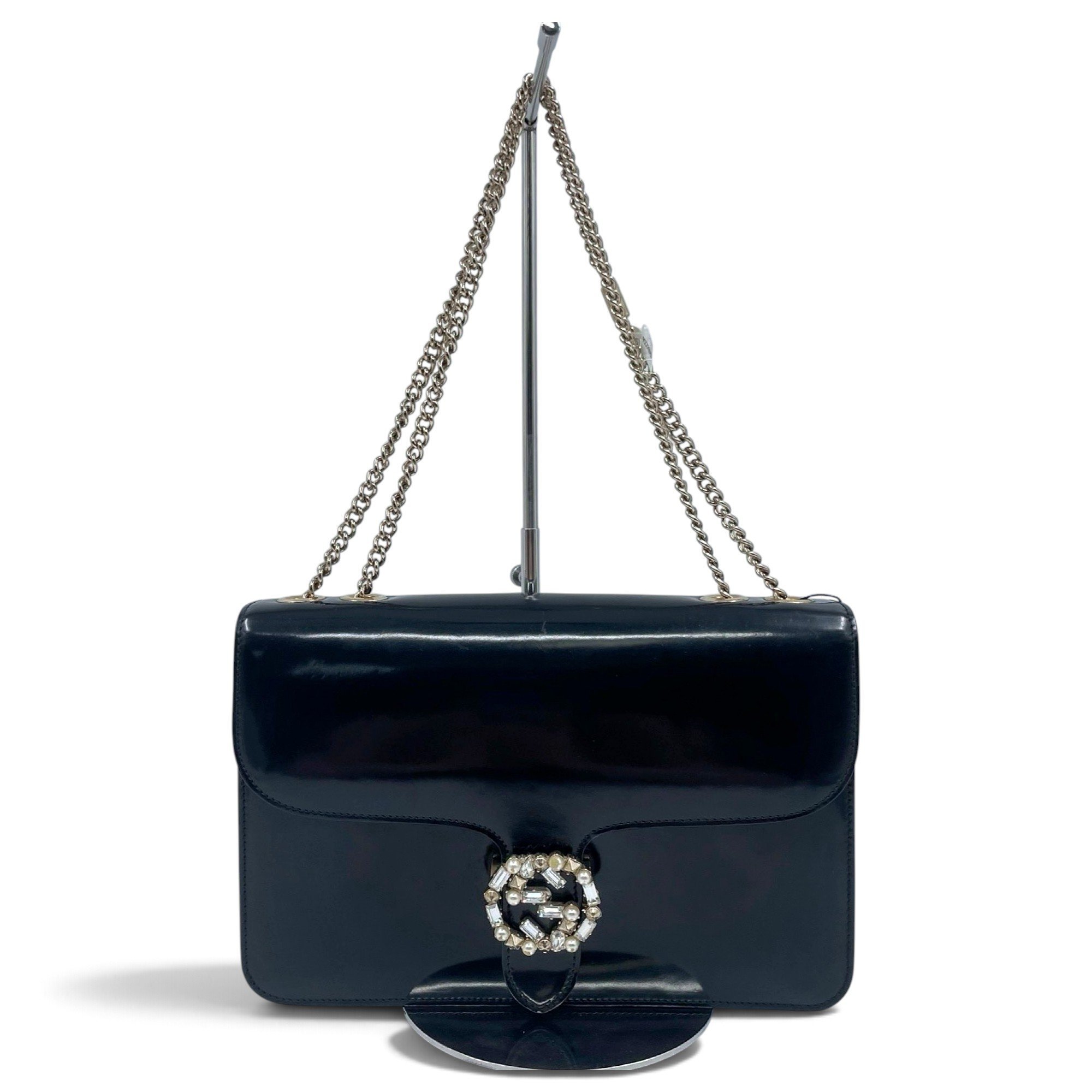 Interlocking patent leather handbag