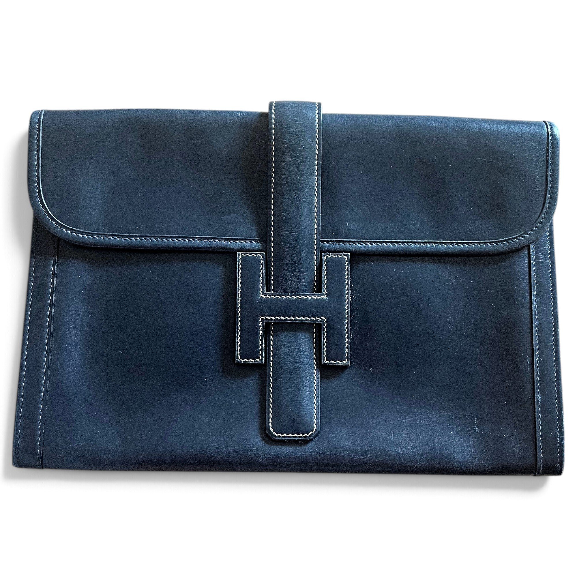 Jige leather clutch bag