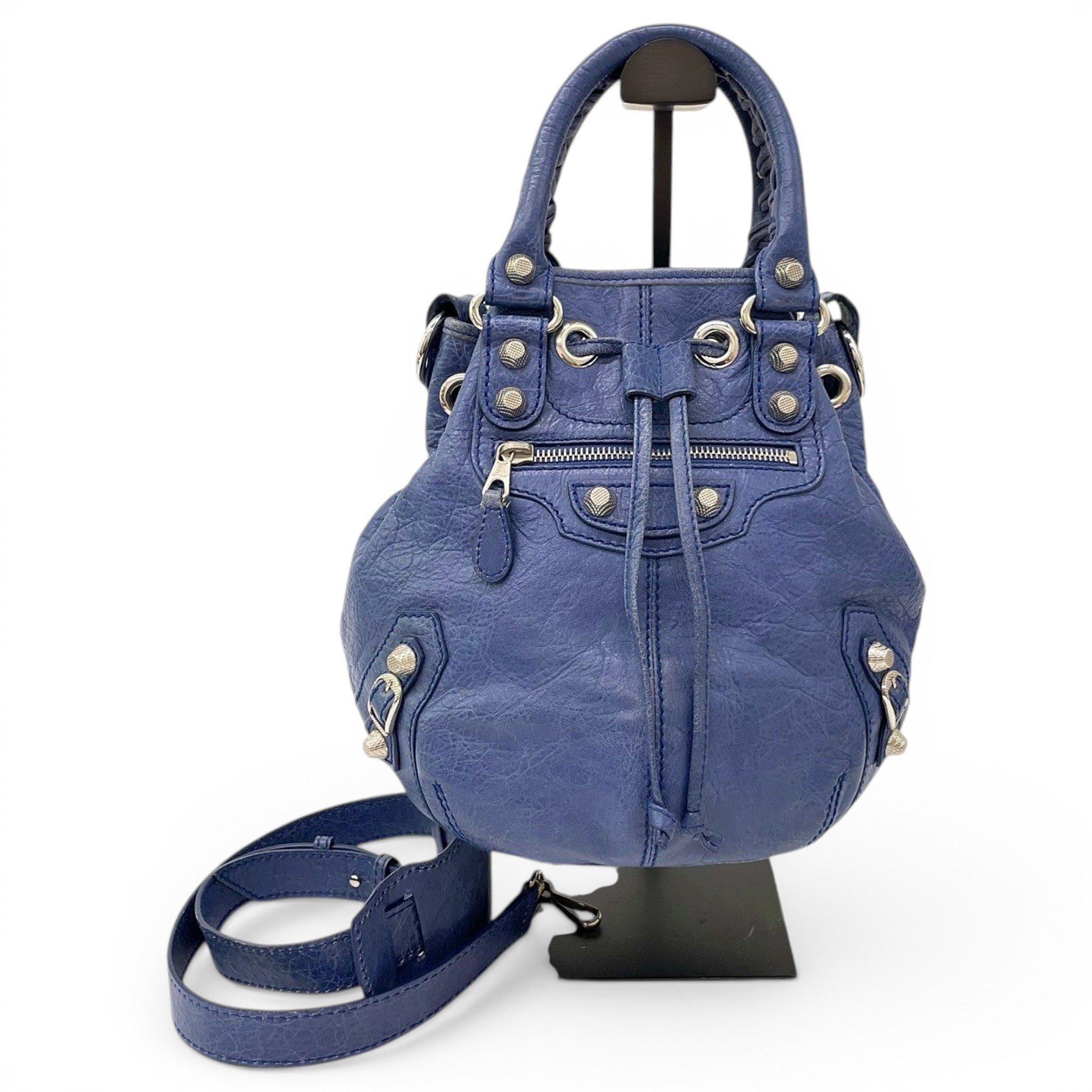 Pompon leather handbag