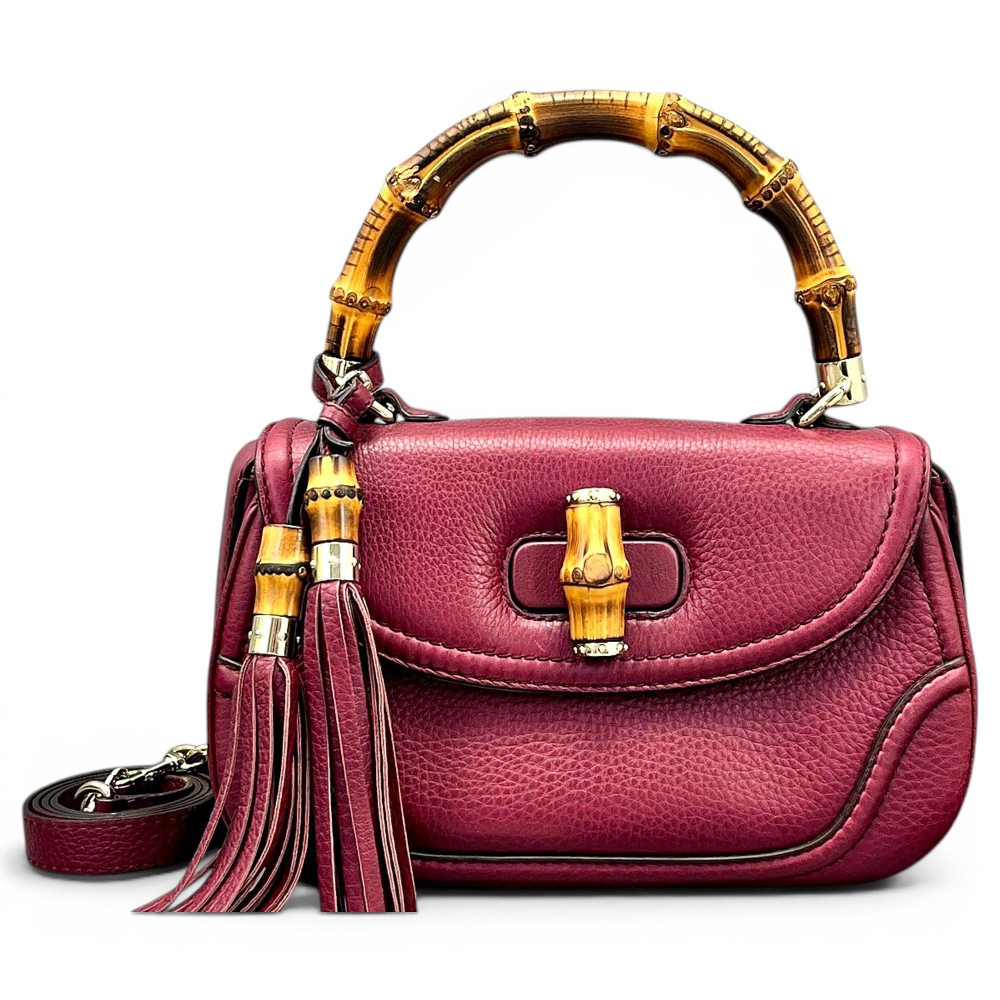 Convertible Pompon Bamboo Top Handle leather handbag