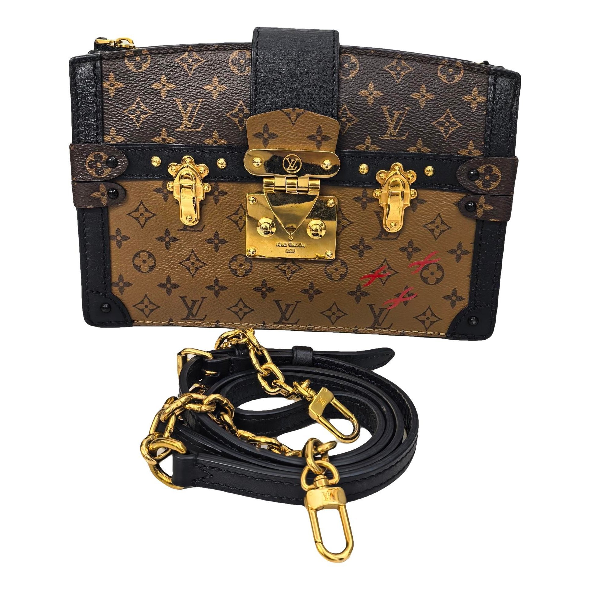 Pochette Trunk leather handbag