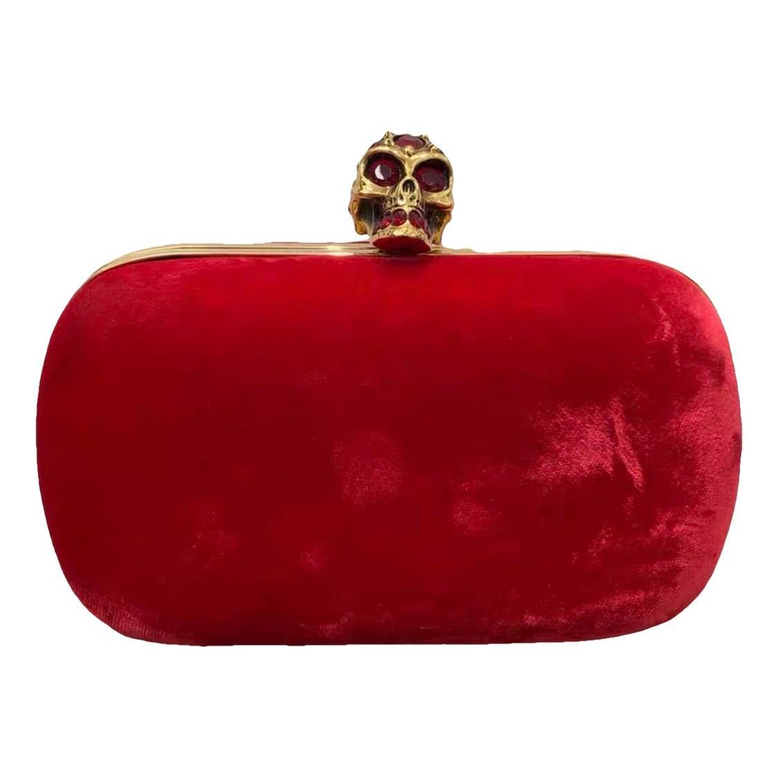 Skull velvet clutch bag