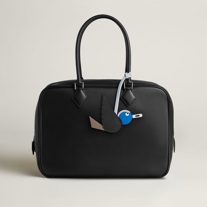 Hermès Birdy charm H083885CKAF on a bag handle