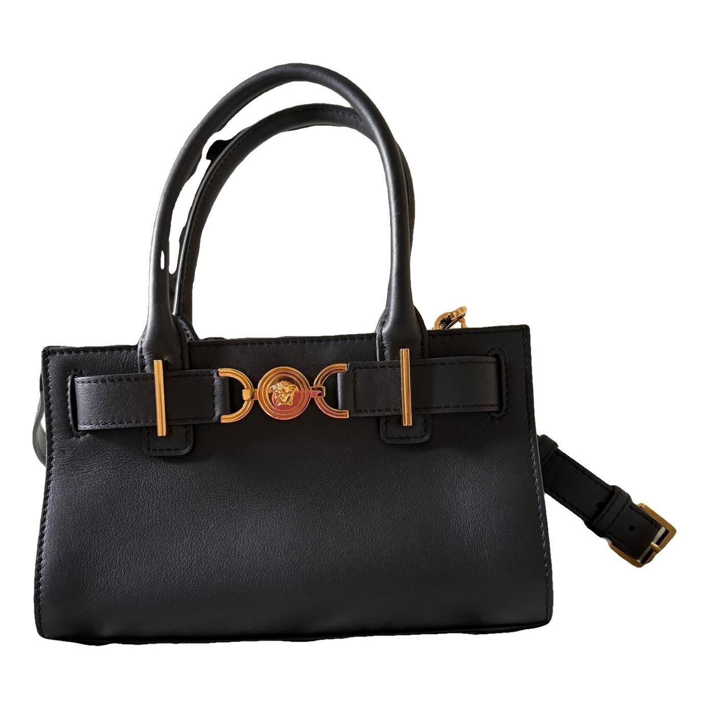 La Medusa leather clutch bag