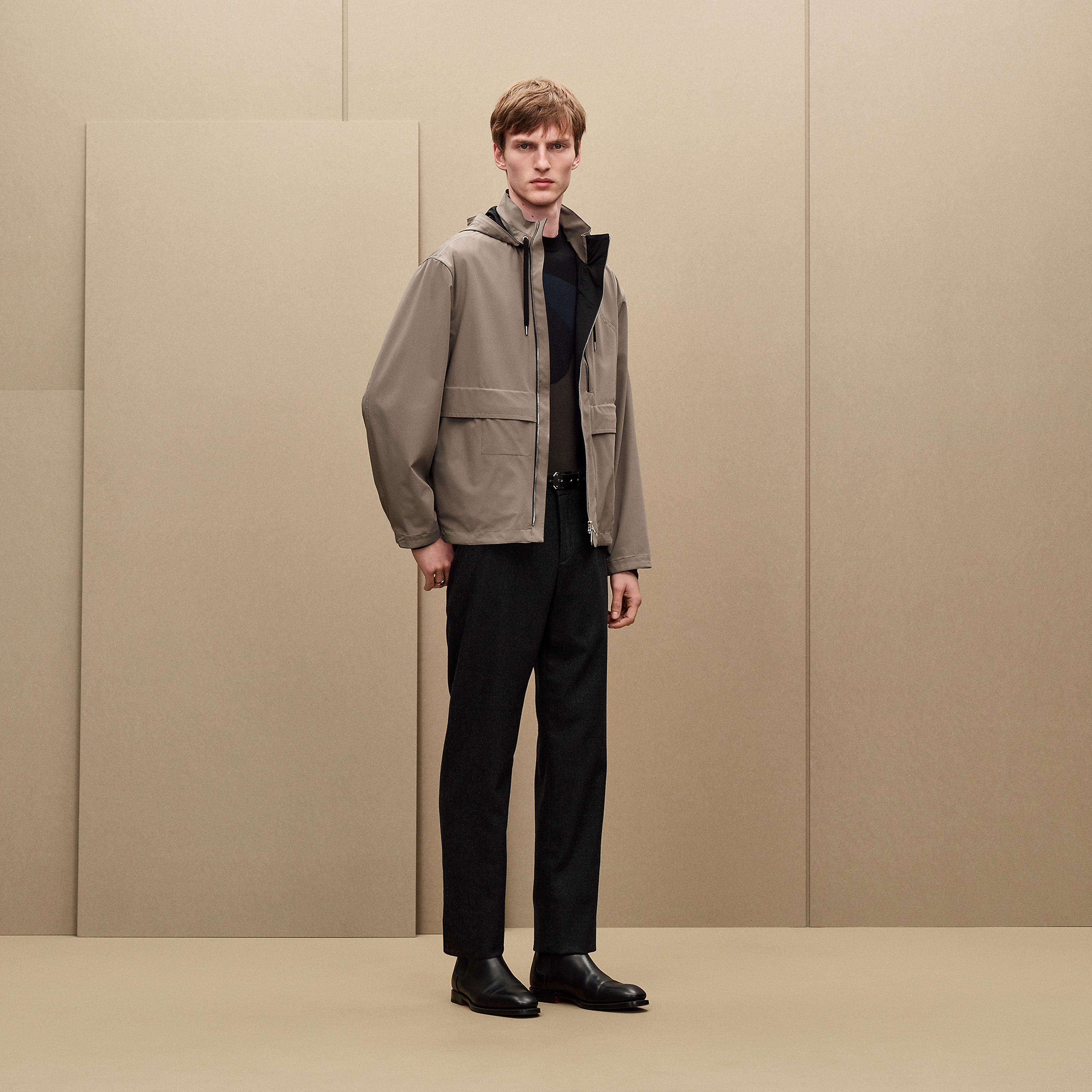 Jacket with foldable hood
