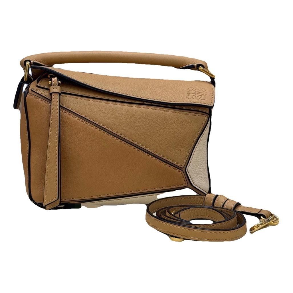 Puzzle leather handbag