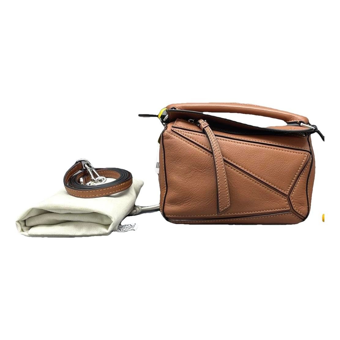 Puzzle leather handbag