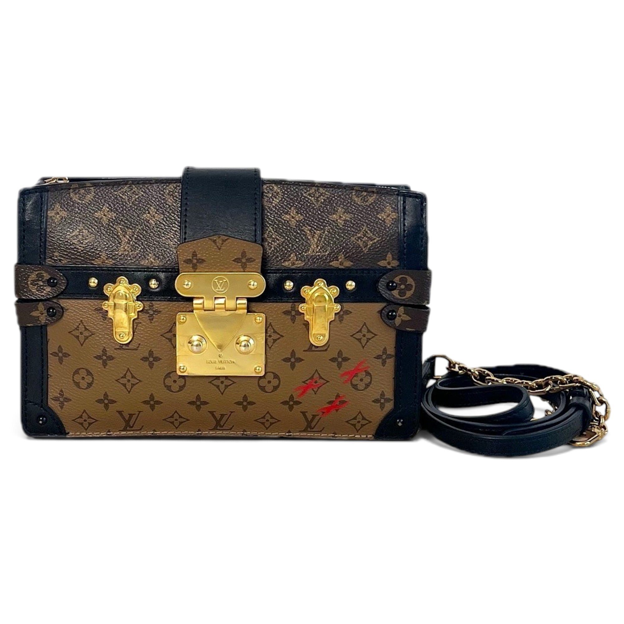 Pochette Trunk leather handbag