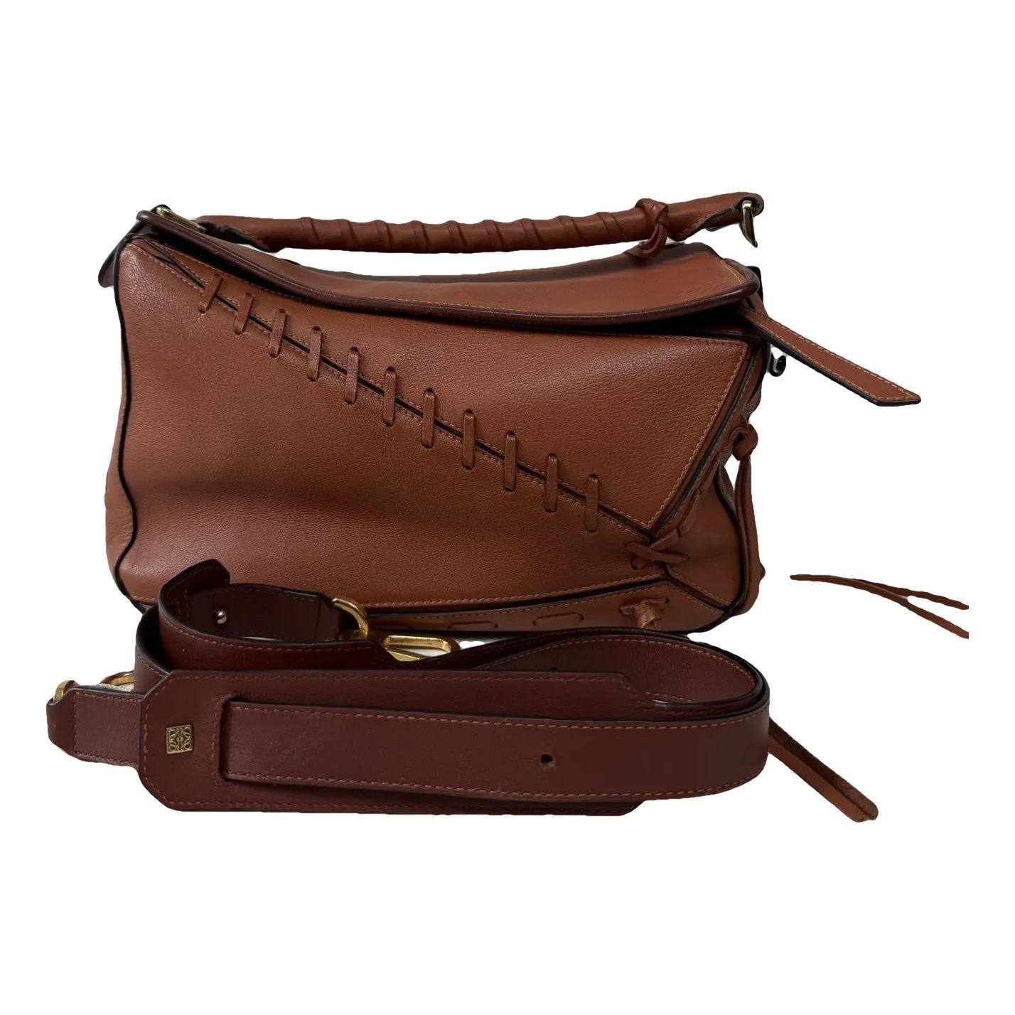Puzzle leather handbag
